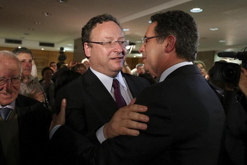 Socialist lead candidate to the european parliament Francisco Assis (left) embracing his leader Antonio Jose Seguro after the results of the party in the european elections, Lisbon, Portugal on May 25, 2014. -- PHOTO: EPA