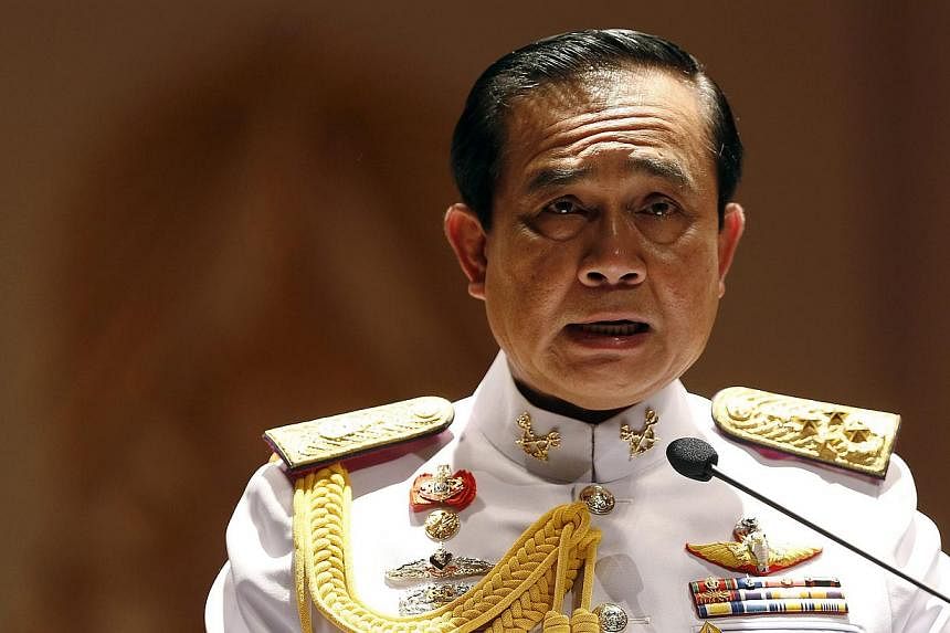 Thai Army chief General Prayuth Chan-ocha addresses reporters at the Royal Thai Army Headquarters in Bangkok on May 26, 2014. -- PHOTO: REUTERS