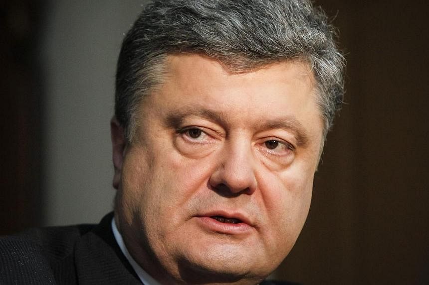 Petro Poroshenko listens during an interview with Reuters in Kiev in this April 4, 2014 file photo. -- FILE PHOTO: REUTERS&nbsp;