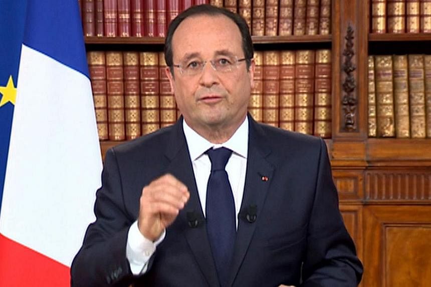 A TV grab taken from French TV channel France 2 shows French President Francois Hollande addressing the nation, on May 26, 2014 during a TV broadcoast at the Elysee presidential Palace in Paris. -- PHOTO: AFP