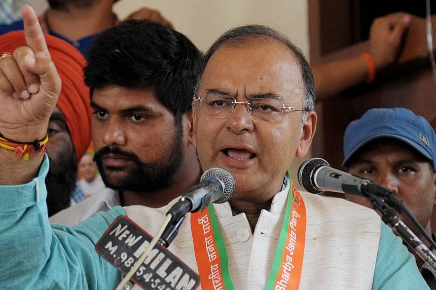 India's new finance minister Arun Jaitley said restoring growth and containing inflation are the key challenges facing the country's government, shortly after being handed the critical portfolio on Tuesday. -- PHOTO: AFP