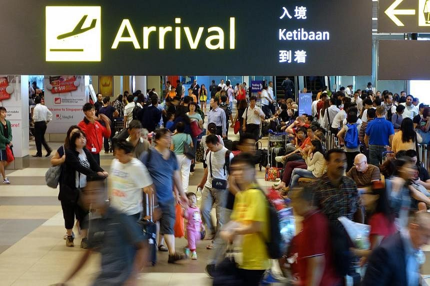 Passengers returning from overseas will have to pay the Goods and Service Tax, if the amount of goods they bring back exceeds the GST relief. -- ST FILE PHOTO