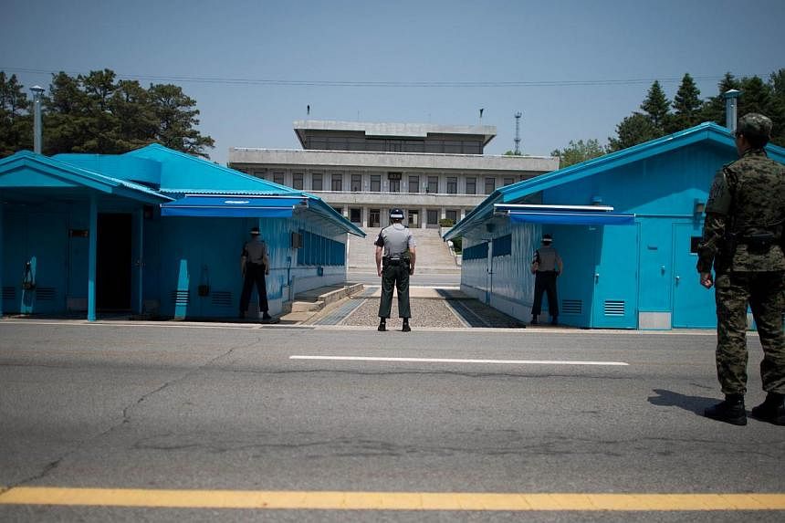 South Korean soldiers face the North korean side of the truce village of Panmunjom in the Demilitarized Zone (DMZ) between North and South Korea on May 14, 2014. -- &nbsp;FILE PHOTO: AFP