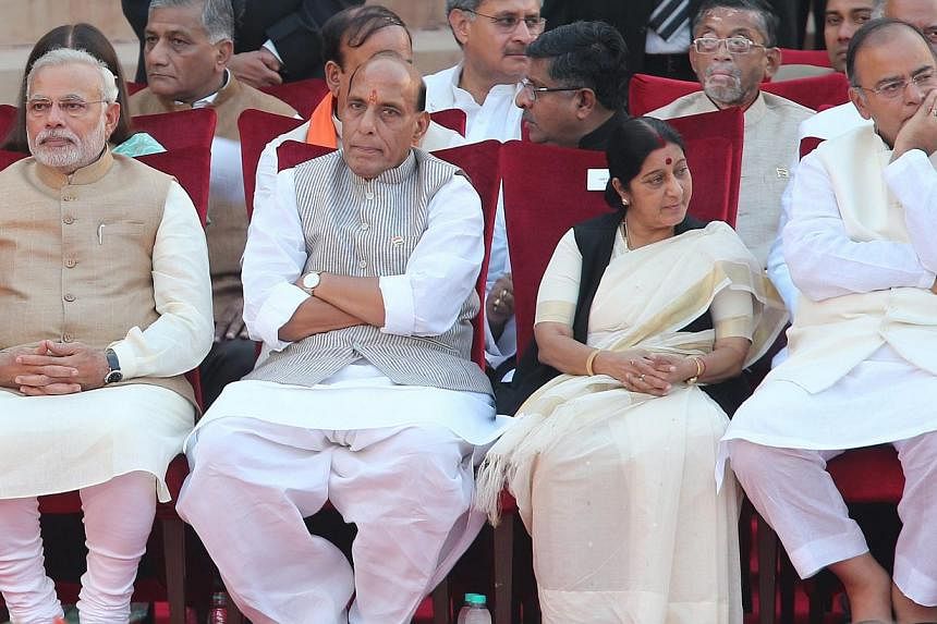 (From left) New Indian Prime Minister Narendra Modi with his new Cabinet Ministers Rajnath Singh, Sushma Swaraj and Arun Jaitley during swearing-in ceremony of Narendra Modi as the new Prime Minister of India at the presidential palace in New Delhi, 