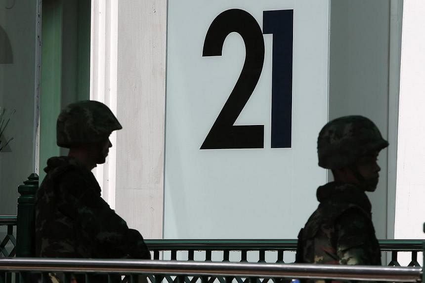 Soldiers stand guard at an elevated walkway at a shopping district in central Bangkok on May 25, 2014. -- PHOTO: REUTERS