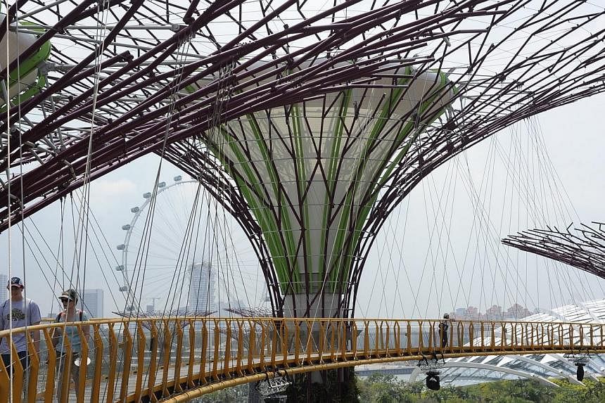 Extensions to Gardens by the Bay and the new Science Centre will be delayed in favour of more urgent projects such as HDB flats, so as to spread out foreign worker demand, Prime Minister Lee Hsien Loong said in Parliament on Wednesday, May 28, 2014. 