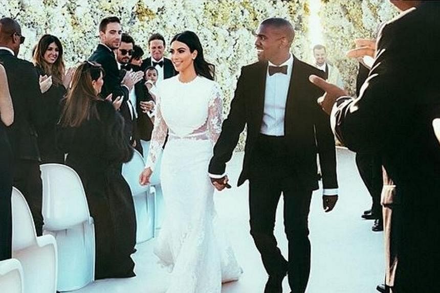Kim Kardashian has finally revealed the dress she wore at her wedding with rapper Kanye West. -- PHOTO: KIM KARDASHIAN/INSTAGRAM