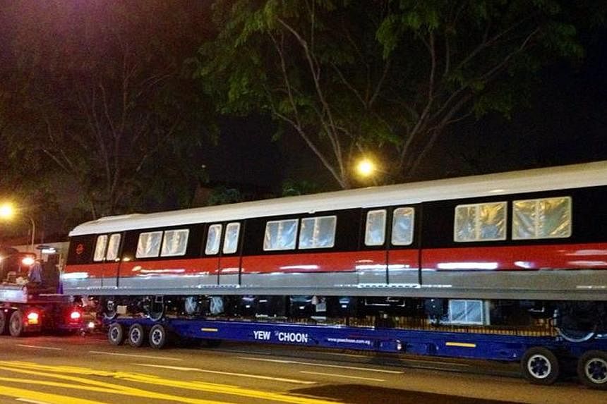 A new MRT carriage being transported along Upper Thomson Road on May 3, 2014.&nbsp;The Land Transport Authority has spent $749 million to buy 91 four-car trains for the upcoming Thomson and Eastern Region Lines. -- ST PHOTO:&nbsp;ARTI MULCHAND