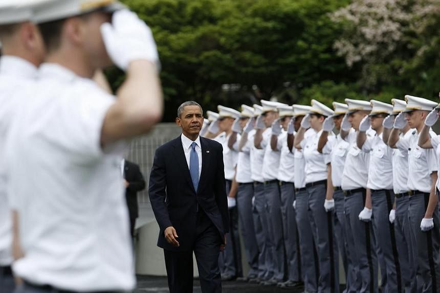 US President Barack Obama arrives for the commencement ceremony at the United States Military Academy at West Point, New York on May 28, 2014.&nbsp;Mr Obama warned Wednesday, May 28, 2014, that the United States was ready to respond to China's "aggre