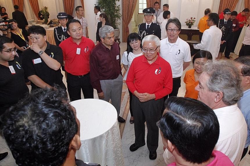 President Tony Tan Keng Yam hosted more than 70 union leaders from the industrial, services and public sectors to tea at the Istana on Wednesday, May 28, 2014. -- ST PHOTO:&nbsp;KEVIN LIM