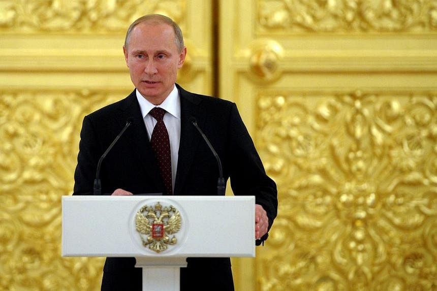 Russia's President Vladimir Putin speaks at the Kremlin in Moscow on May 27, 2014.&nbsp;Mr Putin is due to meet his French counterpart Francois Hollande for Ukraine talks on the eve of events marking the D-Day anniversary, a Kremlin aide said Wednesd