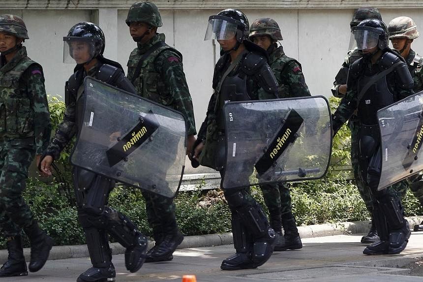 Thai soldiers patrol around the Army Club in Bangkok on May 28, 2014.&nbsp;Thailand's information technology ministry blocked Facebook on Wednesday, May 28, 2014, and planned to hold talks with other social networking sites to stem protests against t