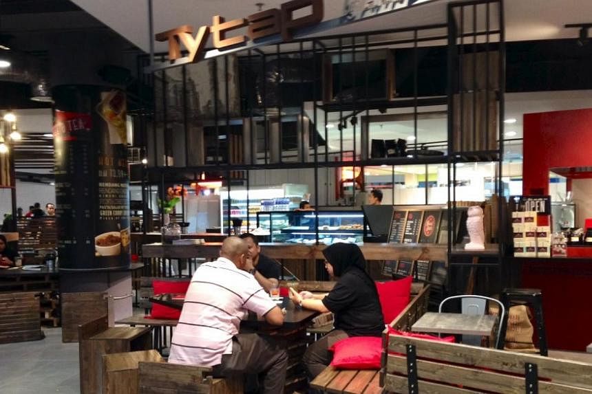 The new KLIA2, which opened on May 2, is a hybrid of a mall and airport, with cafes, stores and shoppers mingling with check-in counters and bag scanners. - PHOTO: CAROLYN HONG&nbsp;