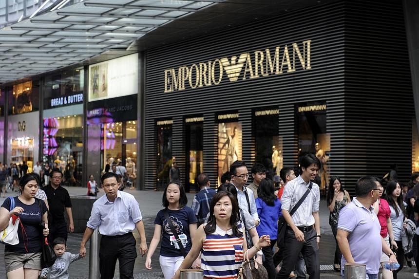 Shoppers in front of Mandarin Gallery along Orchard Road on Jan 9, 2012. Rents for prime shops in Orchard Road remained firm in the first quarter this year but they could soften in the near future, property consultancy Savills said in a report. -- PH