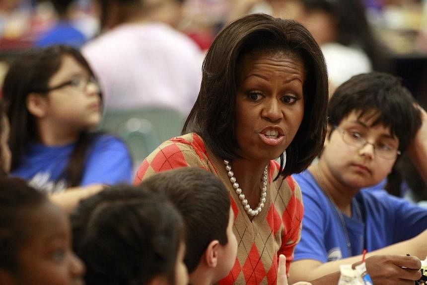 US First Lady Michelle Obama has lunch with students at Parklawn Elementary School in Alexandria, Virginia on Jan 25, 2012.&nbsp;Michelle Obama lashed out in a newspaper opinion piece Thursday, May 29, 2014, against Republican plans to roll back rece