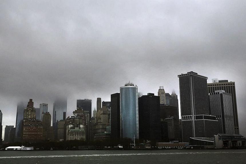 The Financial District in Manhattan is viewed from New York Harbor on April 30, 2014 in New York City.&nbsp;The US economy contracted at an annual rate of 1.0 per cent in the first three months of 2014, a significantly weaker performance than initial