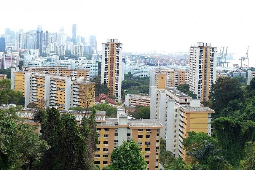 HDB flats as seen from Mount Faber (left). Mr Khaw (right) has mooted giving "absolute priority" to those applying for BTO flats in the same area as their parents but some worry they will want the flat just for its premium location.