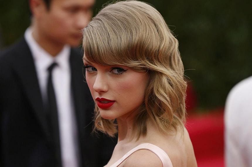 Singer Taylor Swift arrives at the Metropolitan Museum of Art Costume Institute Gala Benefit celebrating the opening of "Charles James: Beyond Fashion" in Upper Manhattan, New York, May 5, 2014. -- PHOTO: REUTERS