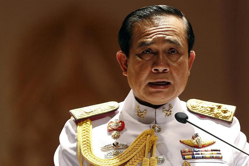 Thai Army chief General Prayuth Chan-ocha addresses reporters at the Royal Thai Army Headquarters in Bangkok on May 26, 2014. -- PHOTO: REUTERS&nbsp;