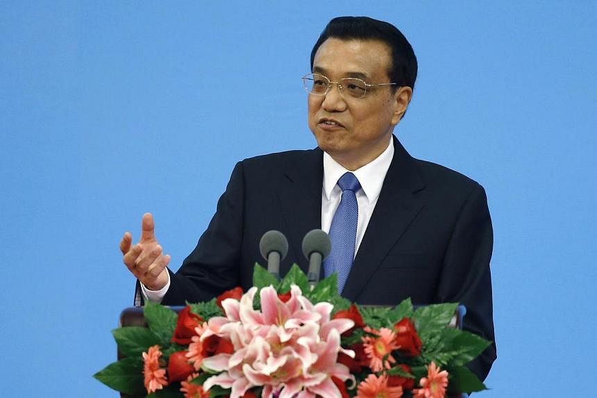 Chinese Premier Li Keqiang delivers a speech during the opening ceremony of the Annual Meeting of Global Research Council at the Great Hall of the People in Beijing on May 27, 2014. Mr Li said that China would adopt moderate fine tuning of its econom