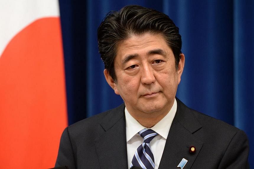 Japan's Prime Minister Shinzo Abe delivers a speech during a press conference at his official residence in Tokyo on May 15, 2014. Mr Abe's message of a bigger global security role for Japan when he speaks at a regional forum this week is likely to fi