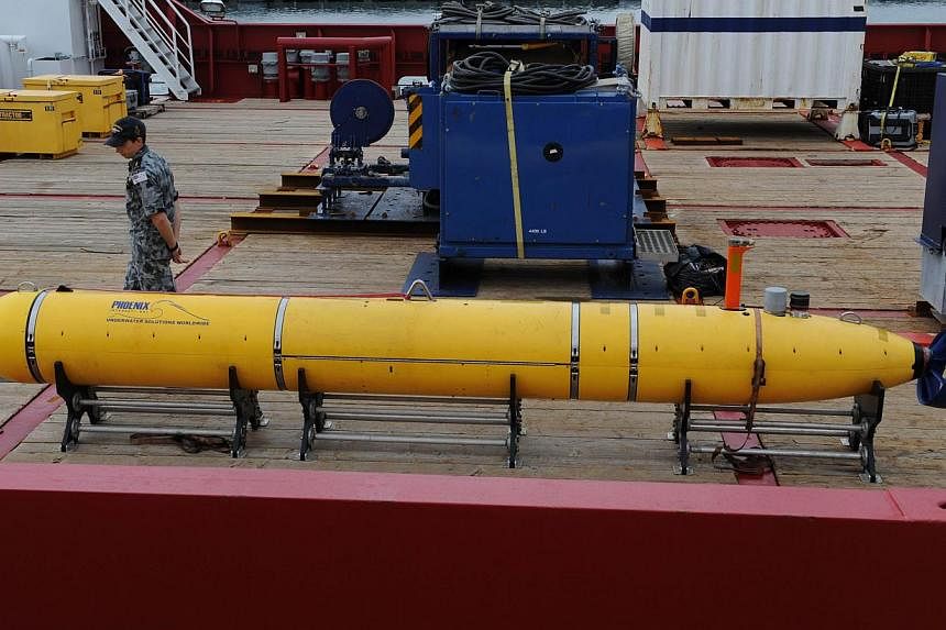 The Phoenix Autonomous Underwater Vehicle Artemis Bluefin-21 on the deck of the Australian navy ship Ocean Shield, berthed at Fleet Base West near Perth on May 5, 2014. -- PHOTO: AFP