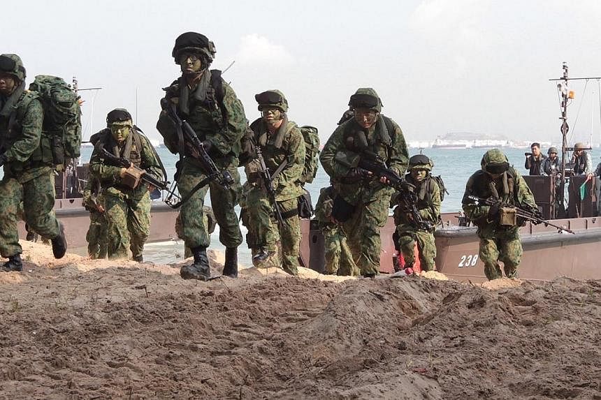 Singapore Armed Forces (SAF) troops participate in&nbsp;Exercise Golden Sand at Pulau Sudong on April 24, 2014. The Defence Ministry will go ahead with recommendations made by a high-level committee upon Government acceptance, despite the "huge admin