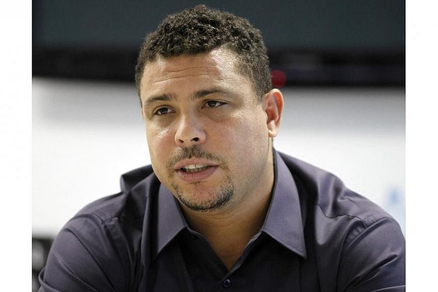 Brazil's former soccer player and member of the FIFA Local Organizing Committee Ronaldo gestures during an interview with Reuters in Sao Paulo on May 23, 2014. -- PHOTO: REUTERS