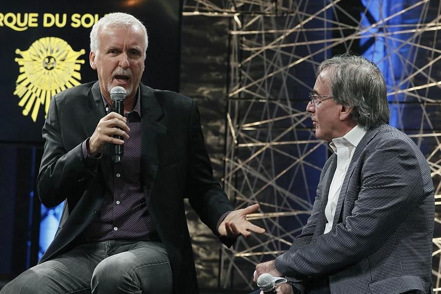 Film director James Cameron (left) and Cirque du Soleil's president and CEO Daniel Lamarre speak during a news conference in Montreal, Quebec, on May 29, 2014. Cameron announced a partnership with Cirque du Soleil to develop an arena-touring show ins