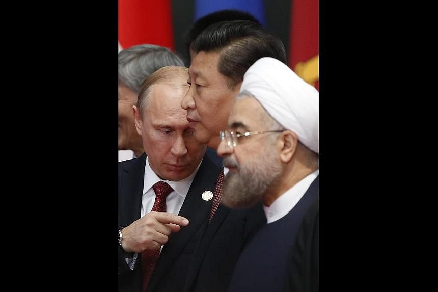 Chinese President Xi Jinping, flanked by Russian President Vladimir Putin (left) and Iranian President Hassan Rouhani, unveiled a new "Asian security concept" in Shanghai last week.