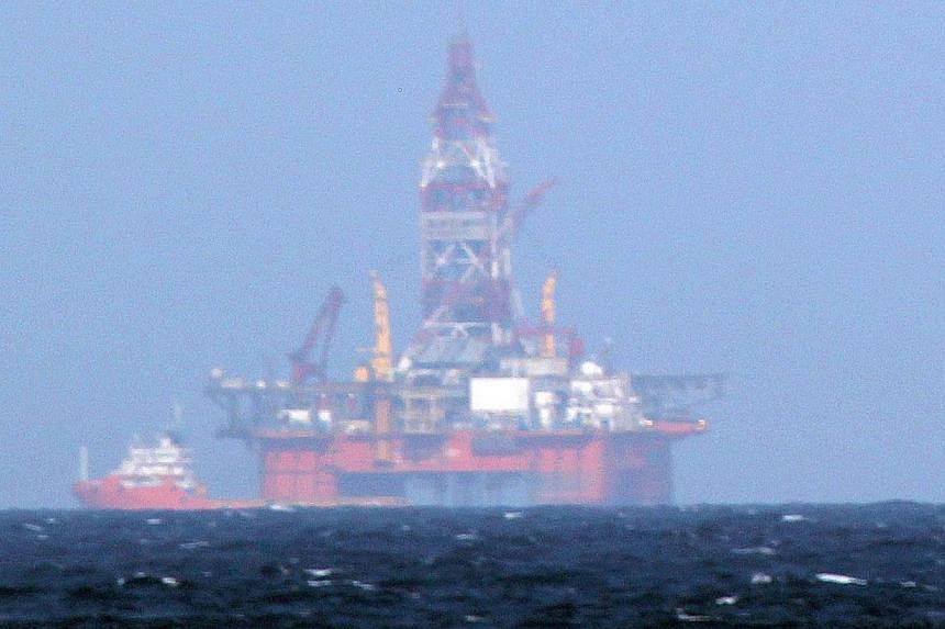 The Chinese oil rig Haiyang Shiyou 981 in the South China Sea. Monday's sinking of a Vietnamese fishing boat in contested waters is a consequence of a dangerous game of cat-and-mouse.