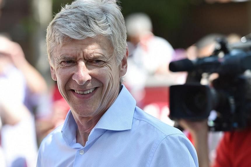 Arsenal manager Arsene Wenger has agreed a three-year contract extension, keeping him at the club until 2017, the BBC reported on Friday.&nbsp;-- PHOTO: AFP