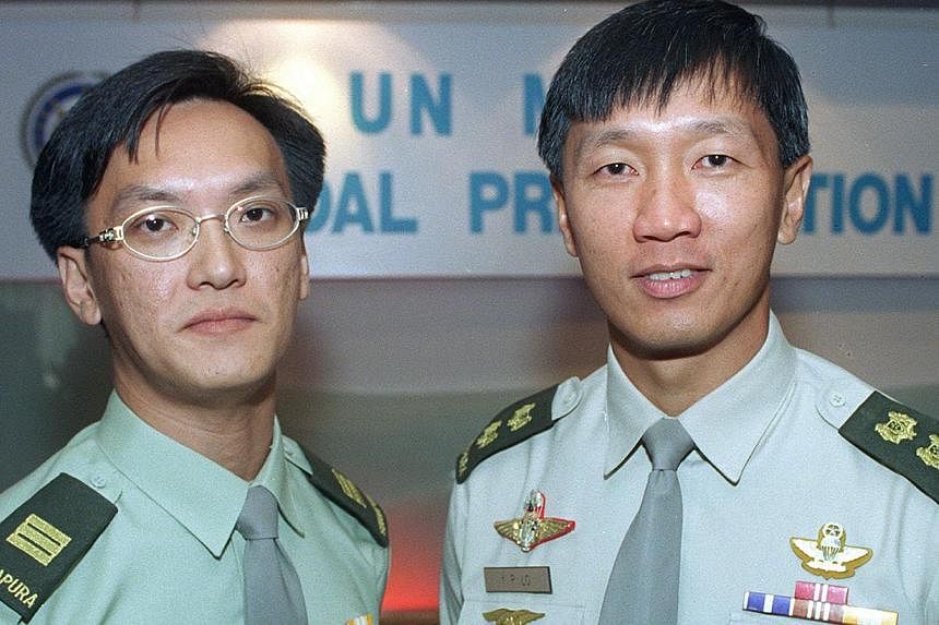Lieutenant-Colonel Lo Yong Poo (right) and Captain (NS) Kok Yin Khong were awarded the SAF Medal for Distinguished Act, becoming the first SAF personnel participating in United Nations missions to receive the medal.&nbsp;-- PHOTO: ST FILE