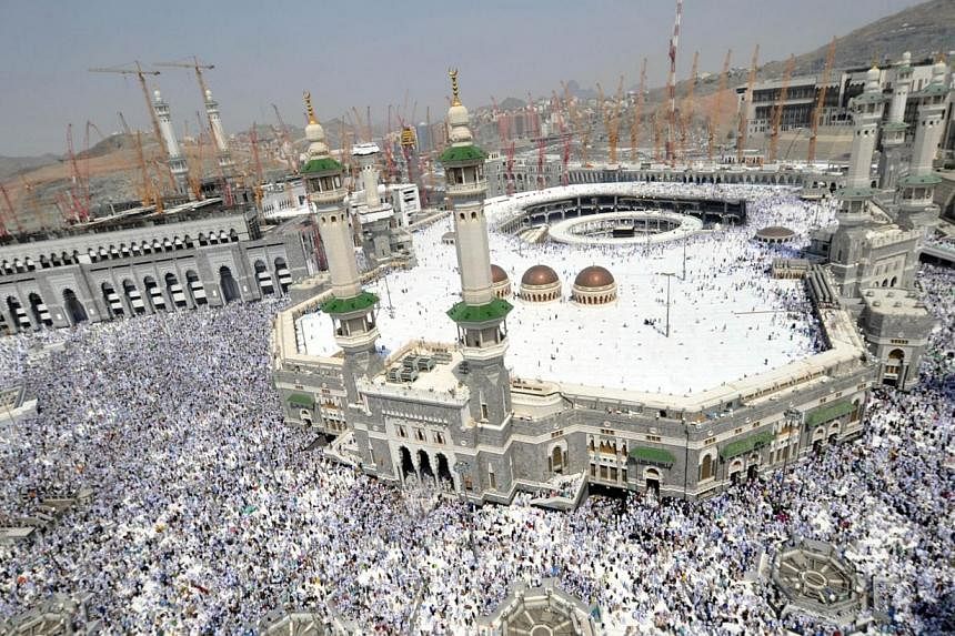 A picture taken on Oct 11, 2013, shows Muslim pilgrims performing the Friday prayer at Mecca's Grand Mosque. Police have denied rumours circulating on social media sites that three pilgrims were killed in a stampede inside the mosque.&nbsp;-- PHOTO: 
