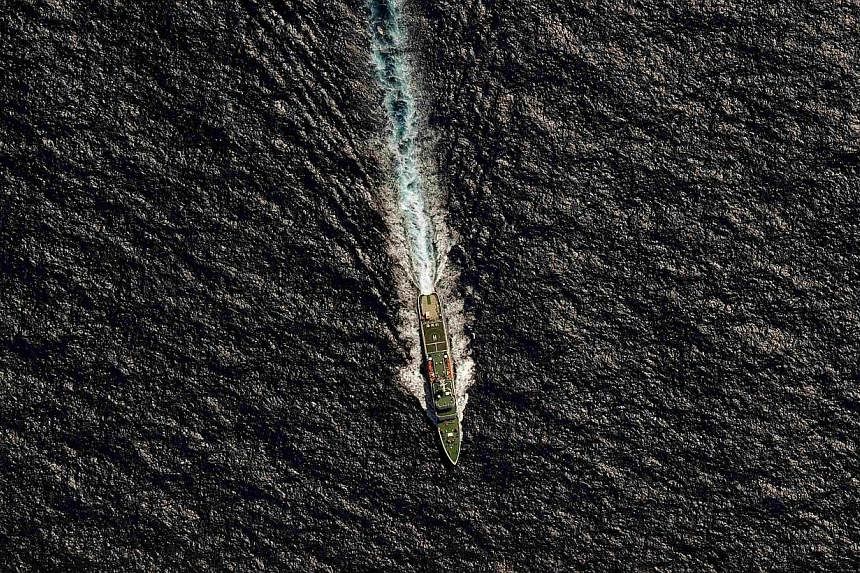 The Chinese Maritime Safety Administration (MSA) vessel Hai Xin 01 is seen from a Royal New Zealand Air Force (RNZAF) P-3K2 Orion aircraft in the southern Indian Ocean, as the search continues for missing Malaysia Airlines flight MH370 on April 13, 2