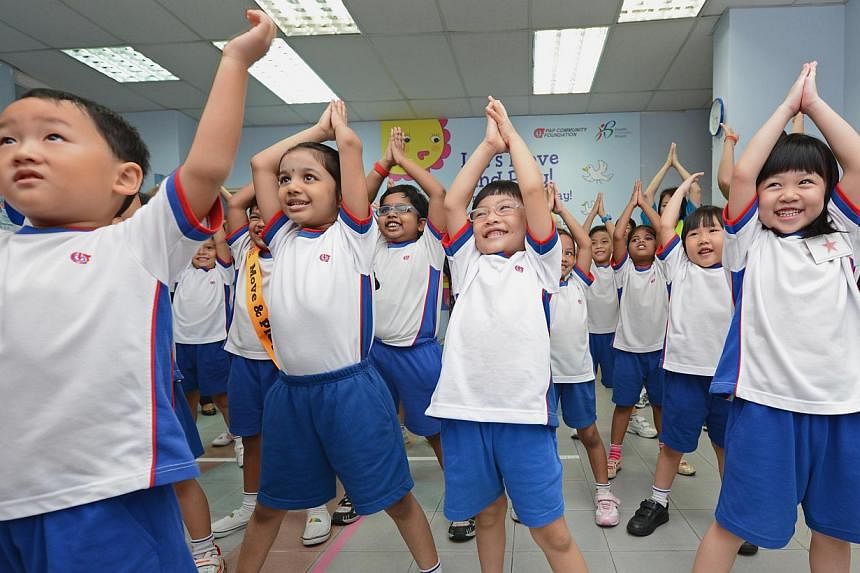 K2 pupils from Tanjong Pagar-Tiong Bahru PAP Community Foundation (PCF) kindergarten exercising in class. People interested in a first-hand experience of pre-school jobs can join a traineeship programme launched today.&nbsp;&nbsp;-- PHOTO: ST FILE