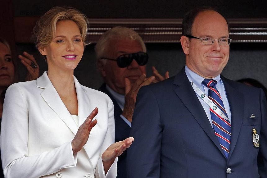 Princess Charlene (left) and Prince Albert II of Monaco attend the Monte Carlo Masters tennis finals in Monaco, on April 20, 2014. Princess Charlene, the South African wife of Monaco monarch Prince Albert II, is expecting the couple's first child at 