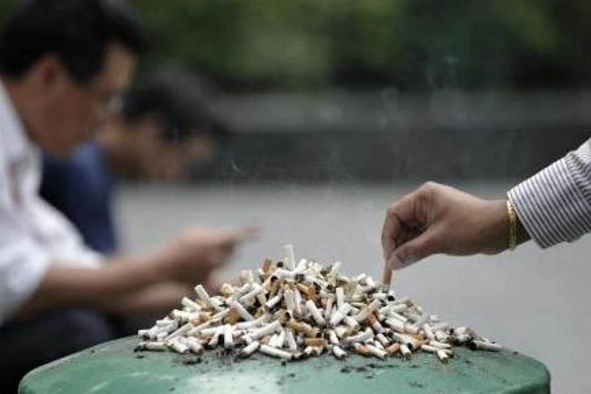 Stubbed-out cigarettes left on a dustbin.&nbsp;The Health Promotion Board (HPB) announced two initiatives on Saturday, which is World No Tobacco Day, to tackle smoking here. -- PHOTO: ST FILE