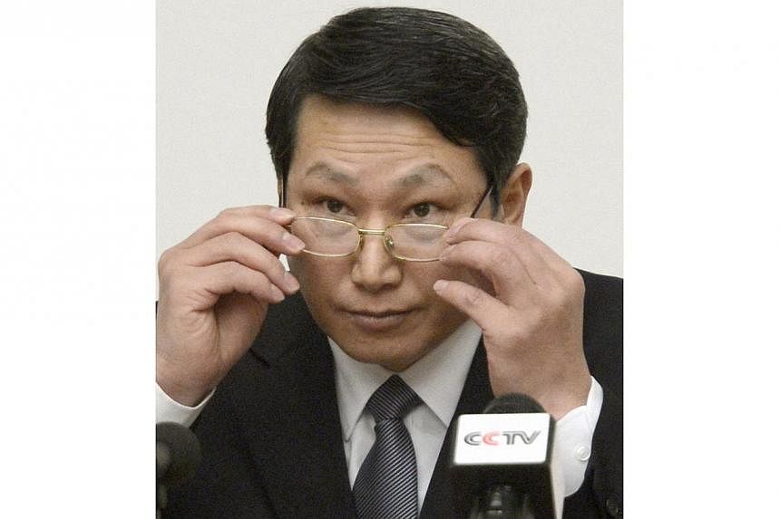 South Korean missionary, identified by the North as Kim Jong Uk, adjusts his glasses during a news conference in Pyongyang in this Feb 27, 2014 file photo provided by Kyodo. North Korea sentenced Kim Jong Uk to life with hard labour on May 30, 2014 a