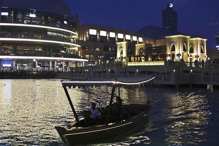 Dubai's Emaar Properties said on Sunday that its Emaar Malls Group has raised a US$1.5 billion (S$1.9 billion) syariah-compliant loan through a consortium of local banks to optimise its capital structure ahead of a planned listing of the unit. -- PHO