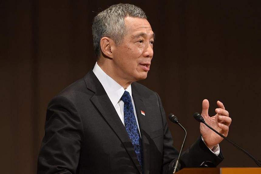 Singapore Prime Minister Lee Hsien Loong delivers a speech during the 20th International Conference on the Future of Asia in Tokyo on May 22, 2014.&nbsp;Improving Singapore is a "journey without end", and the island-state can learn from other cities 