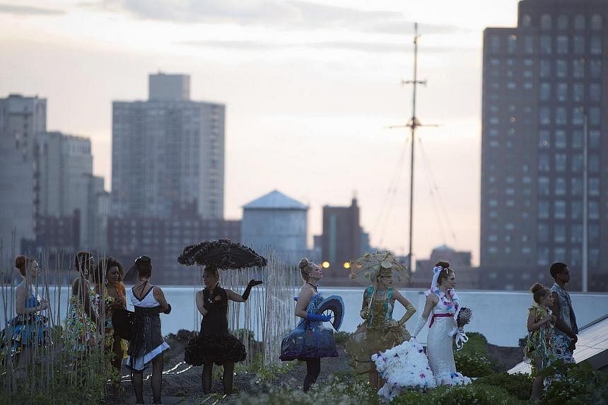 Models take part in the Trashion Fashion Show on the roof of a building in the Brooklyn Navy Yard in the Brooklyn borough of New York on May 31, 2014.&nbsp;-- PHOTO: REUTERS