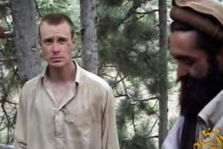 This still image provided on Dec 7, 2010 by IntelCenter shows the Taleban associated video production group Manba al-Jihad Dec 7, 2010 release of US Sergeant Bowe Bergdahl (left), who has been held hostage by the Taliban since his disappearance from 