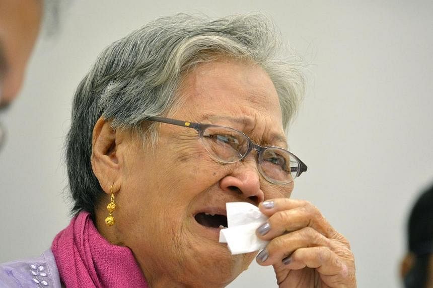 Eighty-four-year-old Estelita Basbano Dy of the Philippines reacts as she speaks during a meeting as part of the 12th Asian Solidarity Conference for the Issue of Military Sexual Slavery by Japan, at Japan's House of Representatives office building i