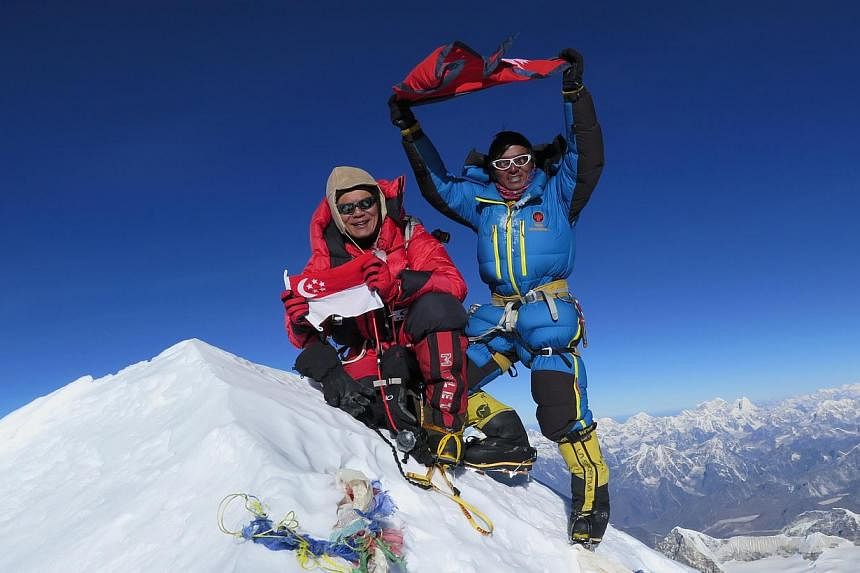 Mr Khoo and his sherpa Mingma atop the 8,463m high Makalu mountain on May 19. A team member died on the climb. Mr Khoo with his wife Wee Leng, 46; son Sheng Feng, 11; and daughter Sheng En, eight. He has insurance policies in place to make sure his f