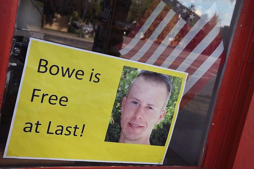 &nbsp;A sign announcing the release of Sgt. Bowe Bergdahl sits in the window of the Hailey Paint and Supply store on Main Street in Hailey, Idaho on June 1, 2014. -- PHOTO: AFP