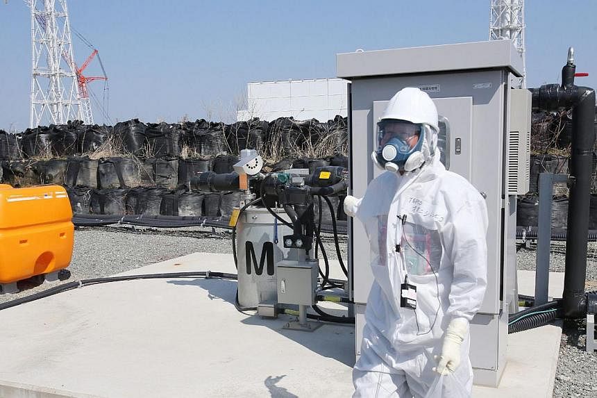 Japan will on Monday start constructing an underground ice wall at the crippled Fukushima nuclear plant, freezing the soil under broken reactors to slow the build-up of radioactive water, officials said. -- PHOTO: AFP