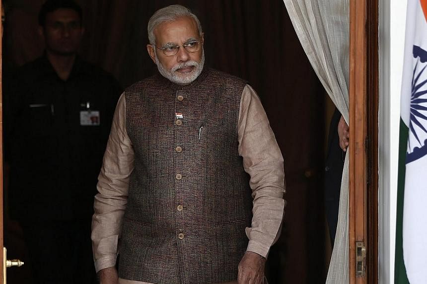 India's new Prime Minister Narendra Modi (above) has chosen a daring former spy with years of experience in dealing with Pakistan as his national security adviser. -- PHOTO: REUTERS