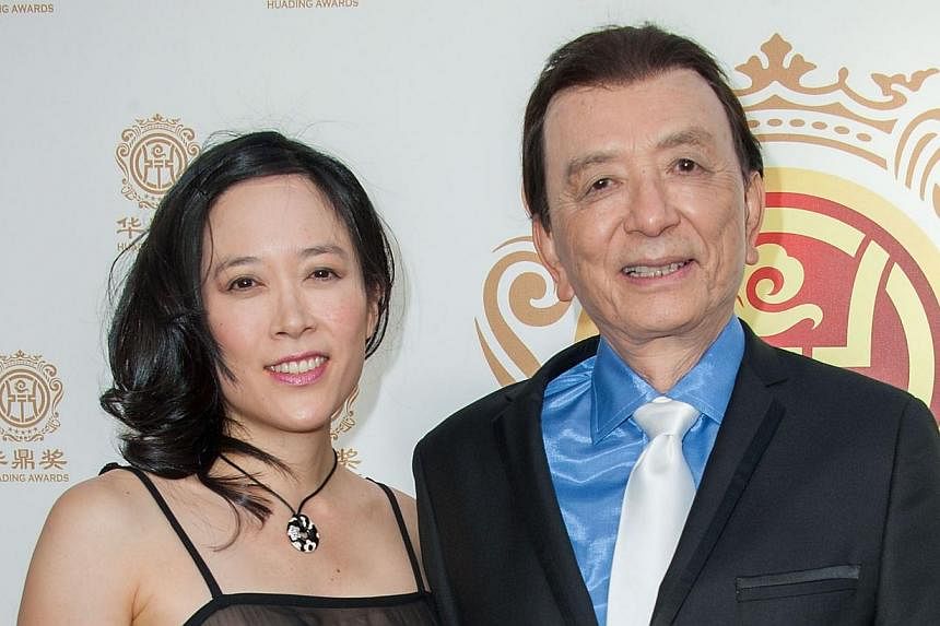 Actor James Hong (right) and daughter April Hong arrive at China's first Film Awards, Huading Film Awards, in Hollywood, California on June 1, 2014. -- PHOTO: AFP