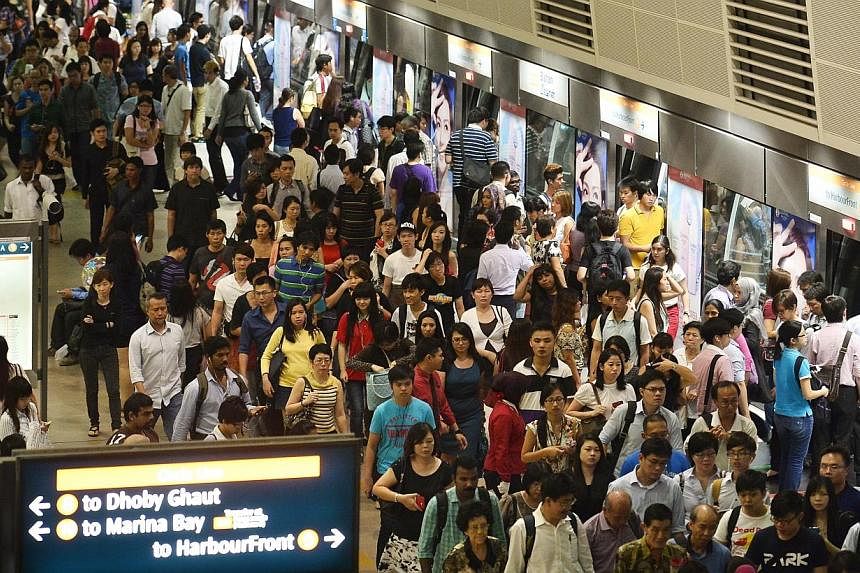 The peak-hour crowd at Bishan MRT station on 7 Oct 2013.&nbsp;Singapore has one of the most cost-efficient public transport networks in the world, according to a study released on Monday. -- PHOTO: ST FILE
